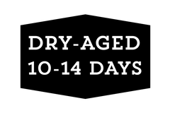 Black hexagonal sign with 'DRY-AGED 10-14 DAYS' text on a white background