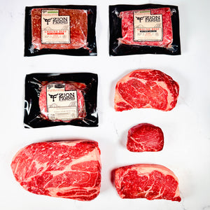 Packaged and unpackaged beef from Zion Farms on a white background. Zion Farms Great Western Box.