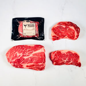 Raw beef steaks with a packaging of Zion Farms on a white background. Zion Farms Miner Box.