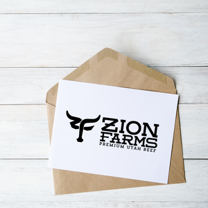 Zion Farms branded gift card on a wooden surface